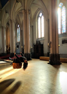 Domizia enjoying a swing we found in a church in Brugge.